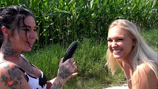 two girls fuck in a corn field